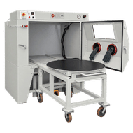 FEVI industrial sandblasting cabinet with front opening, movable workpiece trolley and rotary table