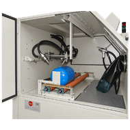 FEVI industrial sandblasting cabinet with workpiece support rollers and horizontally traversing automatic blasting guns for cylindrical components